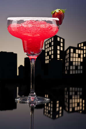 Metropolis strawberry Margarita  cocktail in city skyline settingの写真素材