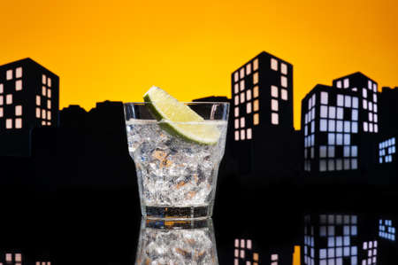 Metropolis Gin Tonic cocktail cocktail in city skyline settingの写真素材