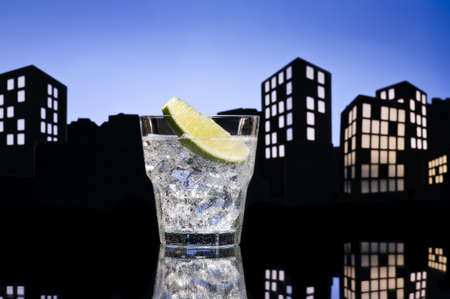 Metropolis Gin Tonic cocktail cocktail in city skyline settingの写真素材