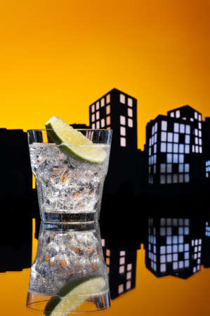 Metropolis Gin Tonic cocktail cocktail in city skyline settingの写真素材