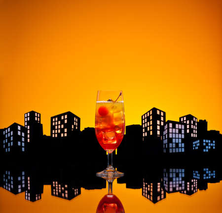Metropolis Tequila Sunrise cocktail in city skyline settingの写真素材