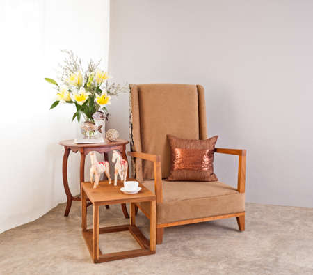 Beige upholstered chair in interior setingの写真素材
