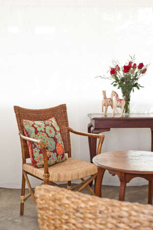 Rattan sofa chair in a patio garden lounge settingの写真素材
