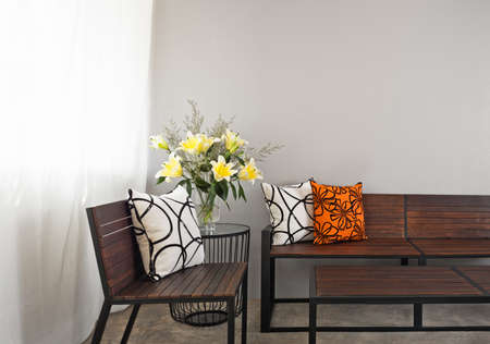 Patio lounge with garden bench and flower decoration