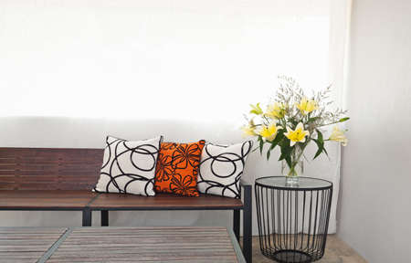 
Patio lounge with garden bench and flower decorationの写真素材