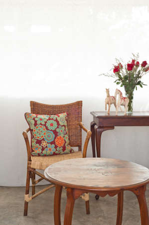 Rattan sofa chair in a patio garden lounge settingの写真素材