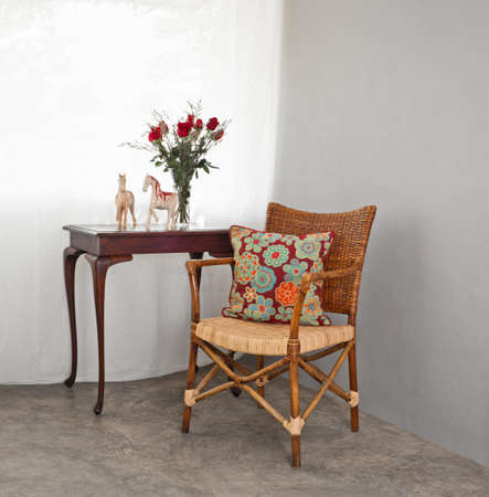Rattan sofa chair in a patio garden lounge settingの写真素材