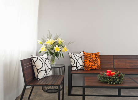 Patio lounge with garden bench and advent wreath flower decorationの写真素材