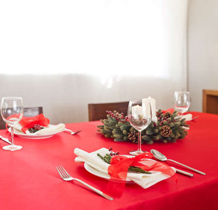 Christmas dinner table setup with advent decoration の写真素材