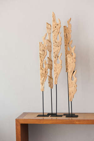 Four Wood sculpture on a side boardの写真素材