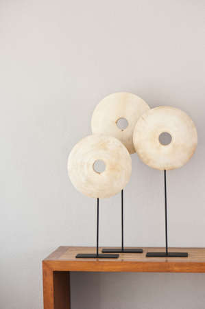 Three Wood sculptures on a side boardの写真素材