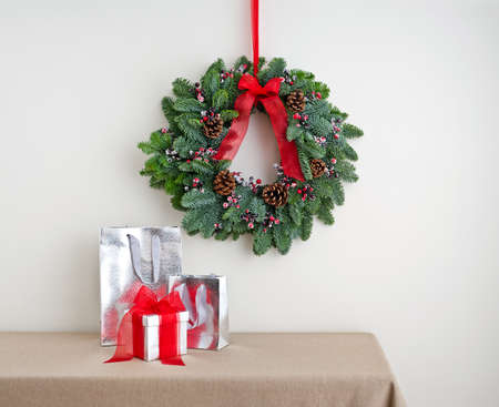 Advent wreath over side board with presentの写真素材