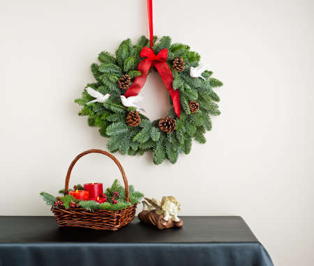 Advent wreath over side board with angel and candleの写真素材
