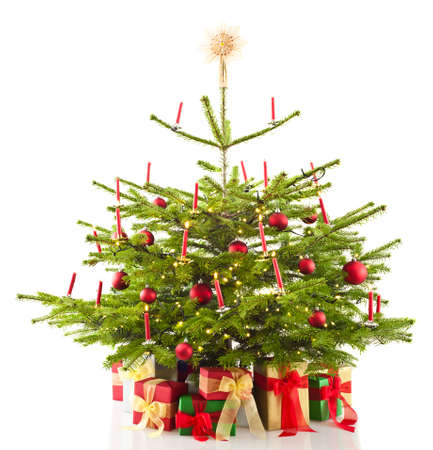 Christmas tree decorated in front of bright backgroundの写真素材