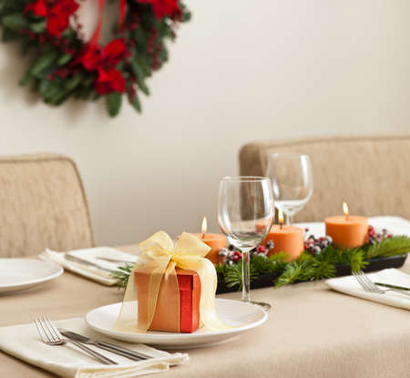 Christmas Dinner table setting in beige orange colorの写真素材