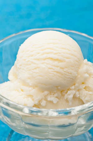 Vanilla Ice cream over a blue backgroundの写真素材
