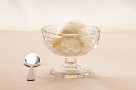 Vanilla Ice cream over a beige backgroundの写真素材