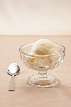 Vanilla Ice cream over a beige backgroundの写真素材