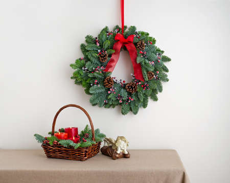 Advent wreath over side board with angel and basketの写真素材
