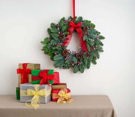 Advent wreath over side board with wrapped color giftsの写真素材