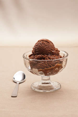chocolate ice cream over a beige backgroundの写真素材