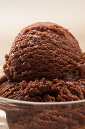 chocolate ice cream over a beige backgroundの写真素材