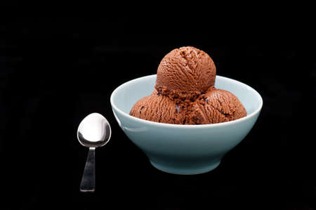 Chocolate ice cream over a black backgroundの写真素材