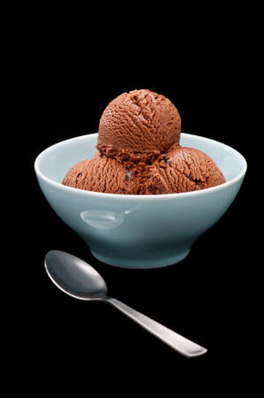 Chocolate ice cream over a black backgroundの写真素材