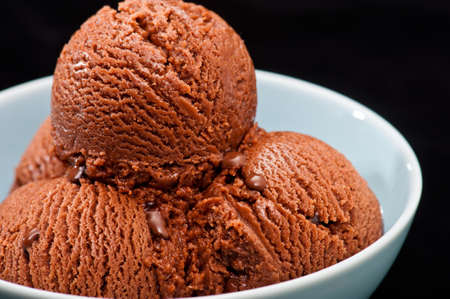 Chocolate ice cream over a black backgroundの写真素材