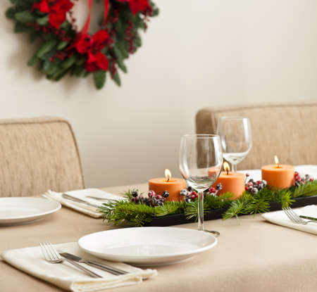 Christmas Dinner table setting in beige orange colorの写真素材