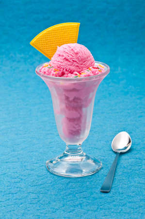 Ice Cream cup isolated over color backgroundの写真素材