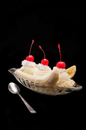Banana Split Ice Cream isolated over color backgroundの写真素材