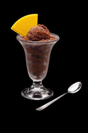 Chocolate ice cream cup with wafer over black backgroundの写真素材