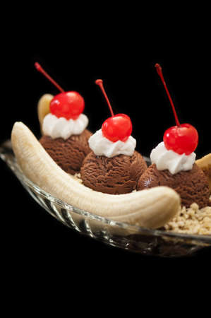 Banana Split Ice Cream isolated over black backgroundの写真素材