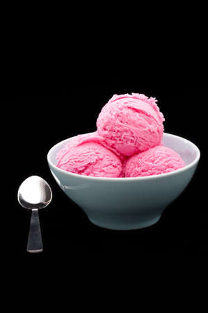 Strawberry ice cream cup over black background
の写真素材
