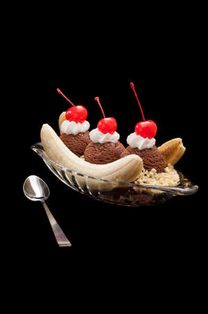 Banana Split Ice Cream isolated over black backgroundの写真素材