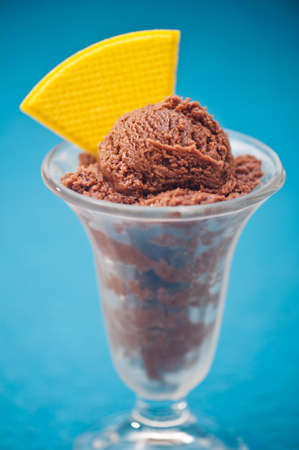 Chocolate ice cream in a glass with with waffle decorationの写真素材