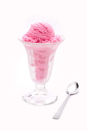 Raspberry ice cream in a tall glassの写真素材