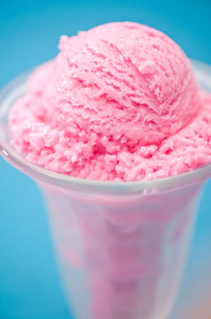 Raspberry ice cream in a tall glassの写真素材