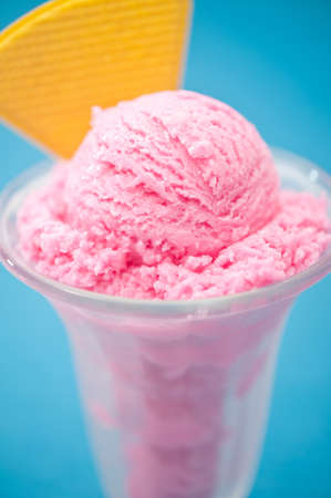 Raspberry ice cream in a tall glassの写真素材
