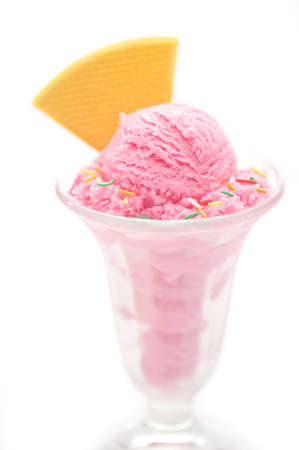 Raspberry ice cream in a tall glassの写真素材