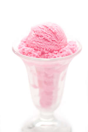 Raspberry ice cream in a tall glassの写真素材
