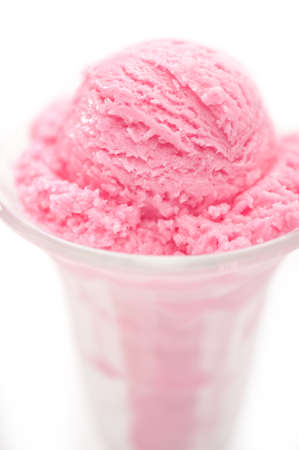 Raspberry ice cream in a tall glassの写真素材