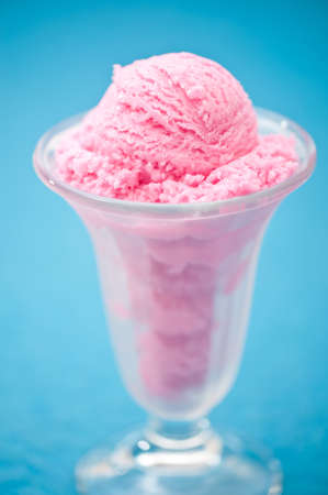 Raspberry ice cream in a tall glassの写真素材