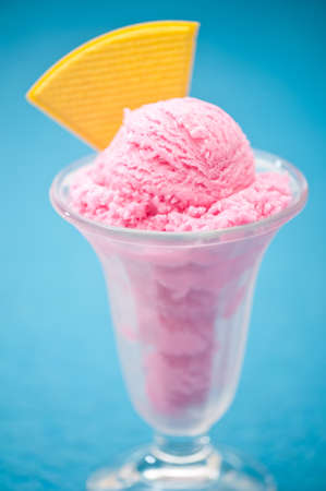 Raspberry ice cream in a tall glassの写真素材