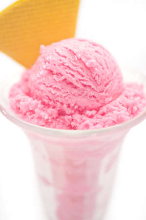 Raspberry ice cream in a tall glassの写真素材
