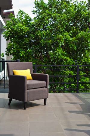 Outdoor patio seating are with nice Rattan sofa at sunsetの写真素材