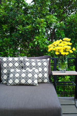 Outdoor patio seating with nice grey daybedの写真素材