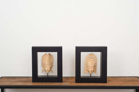 Two pieces of Thai art over side boardの写真素材