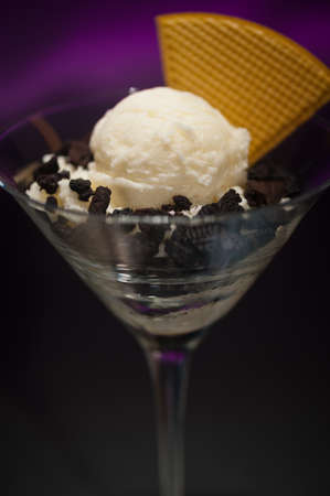 Cookies and ice cream in a Martini glass with with waffle decorationの写真素材